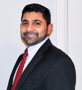 Portrait of Renji Thomas, Associate.